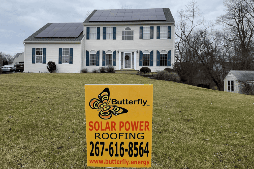 butterfly-yard-sign-in-front-of-home-with-rooftop-solar